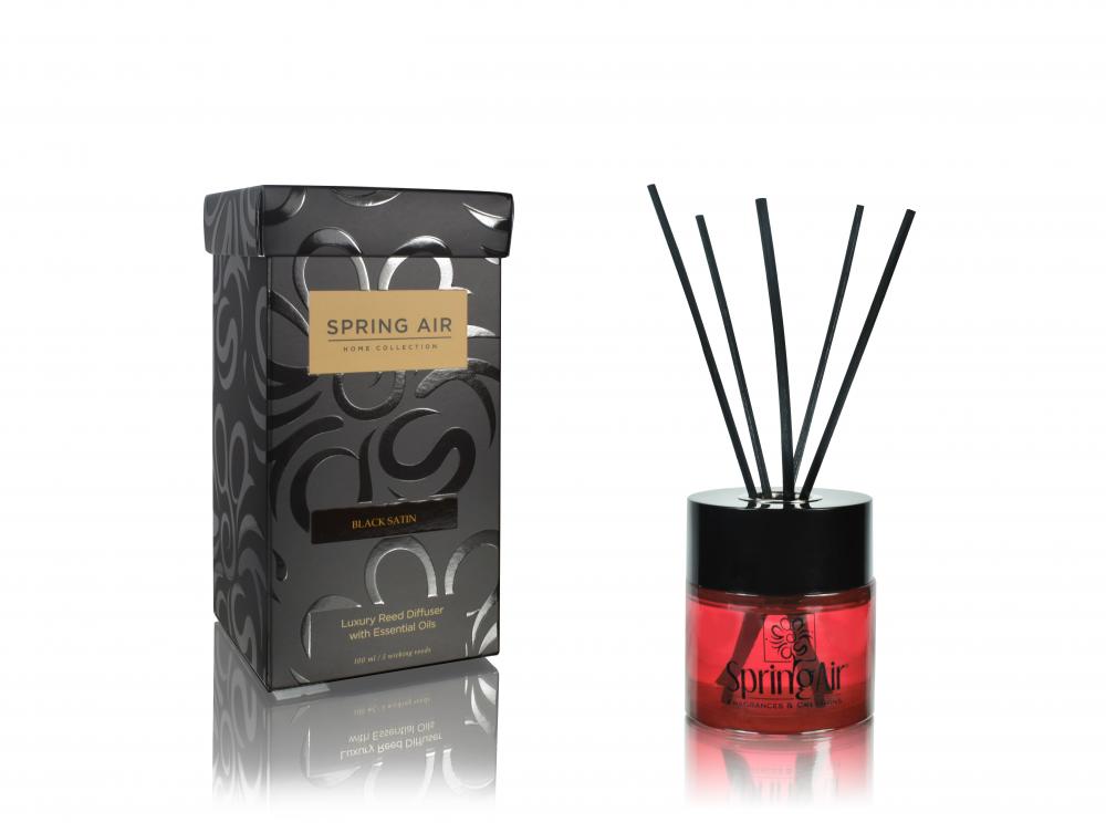 a bottle of air freshener with sticks